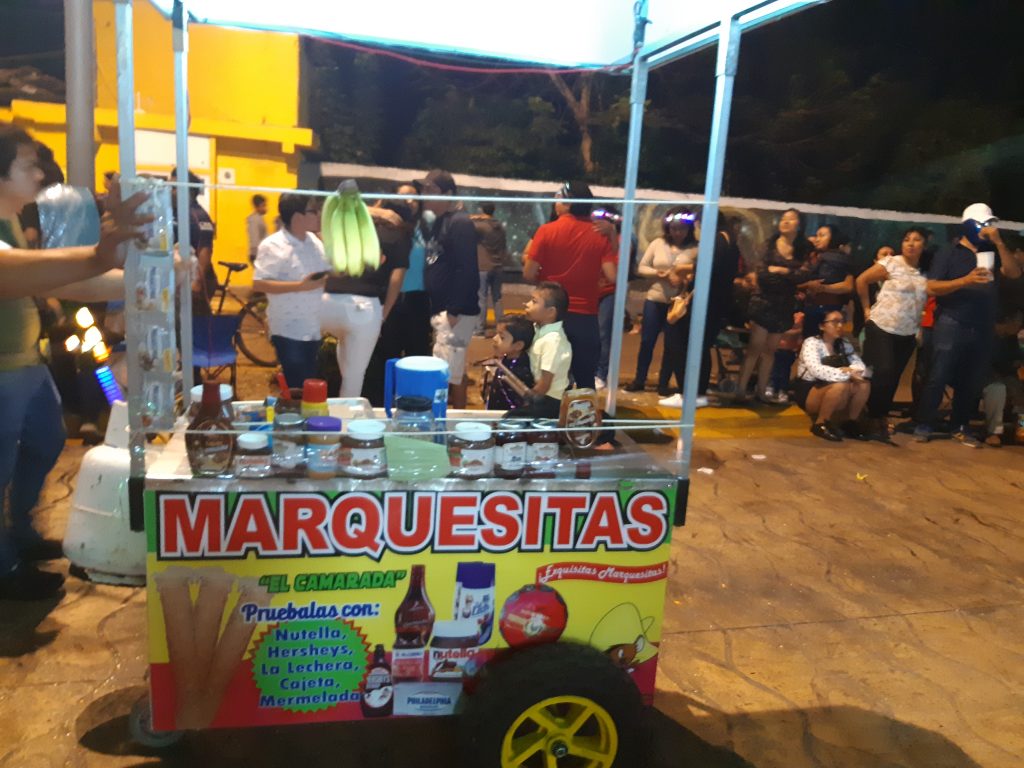 Vendors in the streets selling candy, food, and toys during Cozumel's Carnaval celebration!