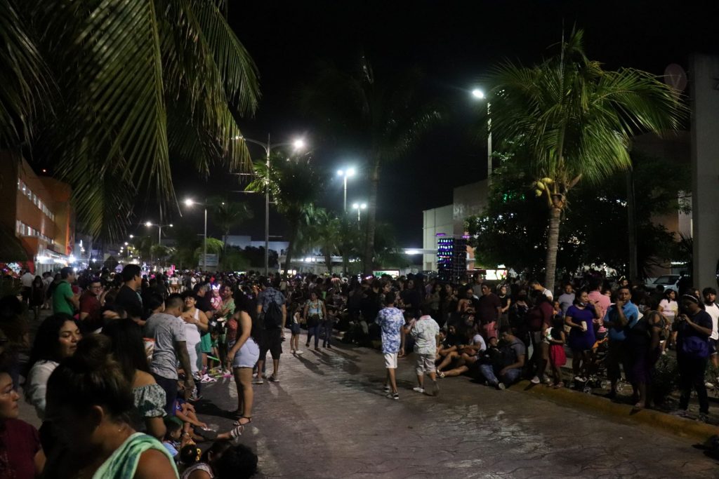 Lots of people lining the street, getting ready for the accessible parades during Cozumel's Carnaval celebration!