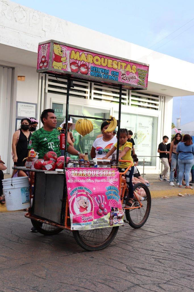 Vendors in the streets selling candy, food, and toys during Cozumel's Carnaval celebration!