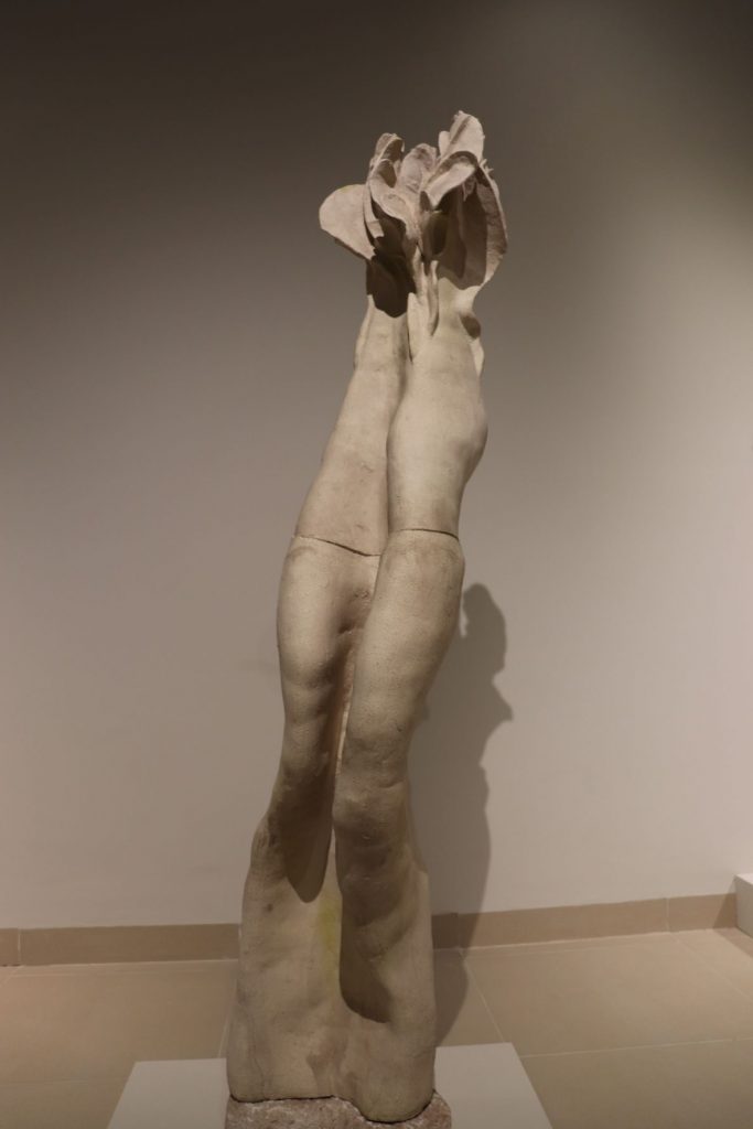 Tall modern sculpture on display in the gallery of Museo de la Isla de Cozumel.