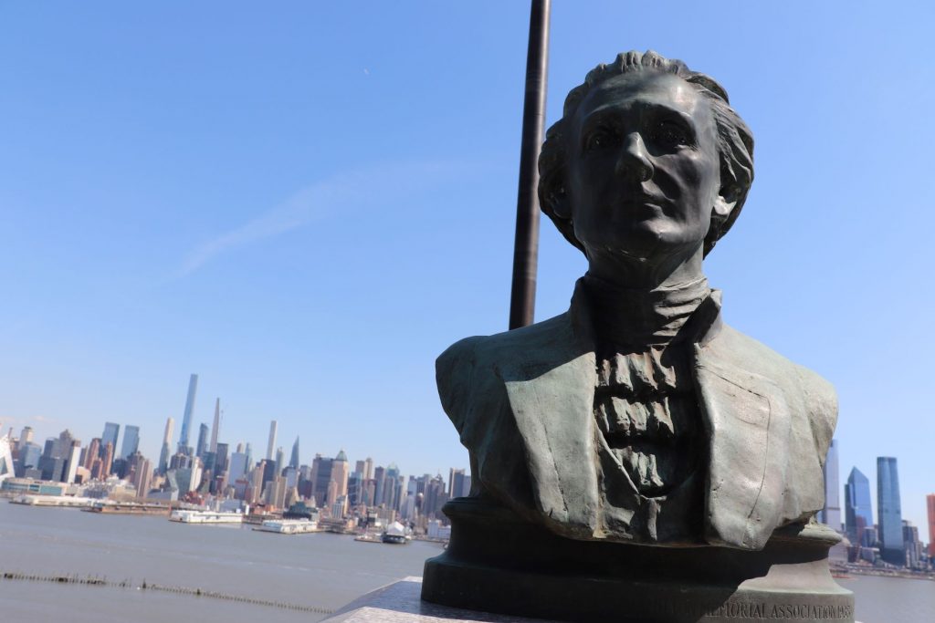 This bronze bust of Alexander Hamilton marks the spot where he and Burr had their famous deadly duel. You can see the river and the New York City skyline in the distance.